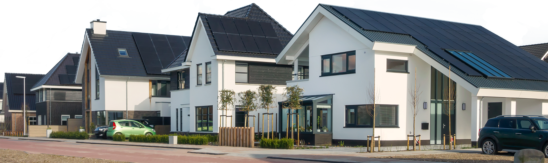 row of homes with solar panel systems on roof
